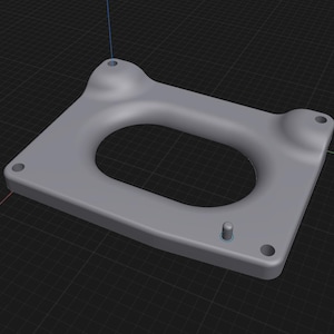 Op de afbeelding: Een lichtgrijs, rechthoekig object met afgeronde hoeken en een ovale uitsparing in het midden. Het heeft vier cirkelvormige gaten en een kleine cilindrische uitsteeksel. Het object lijkt van een vast materiaal te zijn gemaakt.