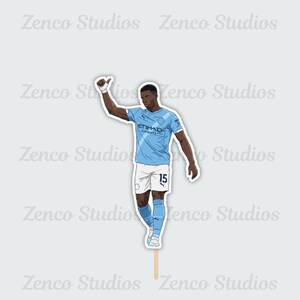 May include: A sticker featuring a cartoon illustration of a soccer player in a light blue jersey with the number 15. The player is giving a thumbs up. The sticker has the text "Zenco Studios" and "ETIHAD AIRWAYS".