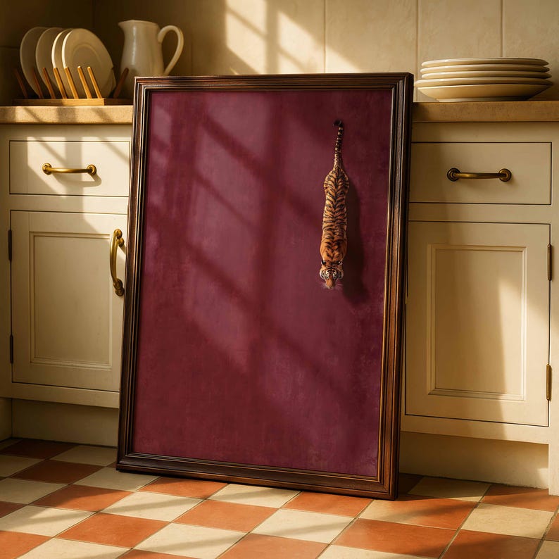 May include: A rectangular framed wall art piece featuring a deep burgundy velvet-textured background. A small, detailed tiger figurine is attached to the upper right section of the board, positioned vertically as if climbing downward.