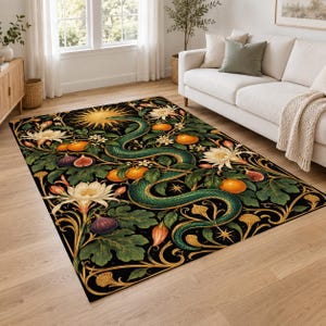 May include: A rectangular area rug featuring a black background with a central green snake winding through orange fruit, dark purple figs, and large white flowers. The design includes a golden sun, star accents, and intricate gold scrollwork borders.
