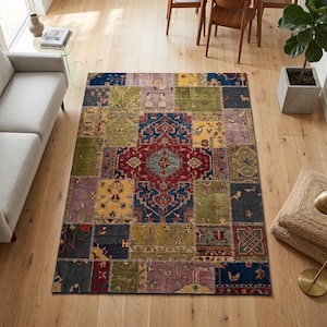 May include: A multi-coloured patchwork rug with a central medallion design. The rug features geometric and floral patterns in shades of blue, red, yellow, green, and purple. The rug is rectangular and appears to be made of woven material.