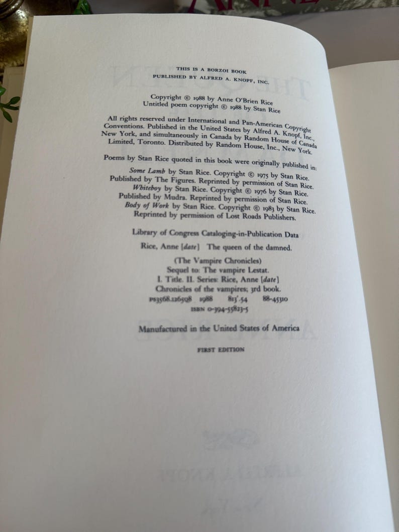 May include: Open book page with text. The text includes copyright information, publishing details, and a list of poems by Stan Rice. The book is titled "The Vampire Chronicles" and is a first edition.