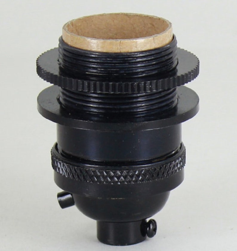 May include: Black metal light bulb socket with a threaded base and a side switch.