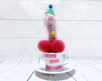 crocheted penis in a cup, '' clown fpr breakfast ''