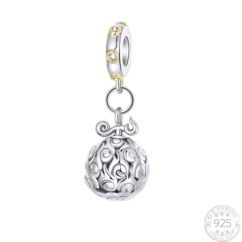May include: A silver charm bead featuring a spherical pendant with a swirling, flame-like pattern and a top loop. The bead has a cylindrical core accented with small gold-toned circular details. A circular stamp in the corner reads 925.