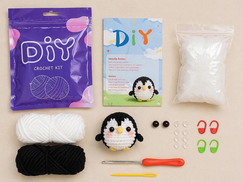May include: A DIY crochet kit with a penguin theme. The kit includes purple packaging with "DIY CROCHET KIT" text, white and black yarn, a crochet hook, and a finished penguin. Also included are safety eyes, stitch markers, and stuffing.