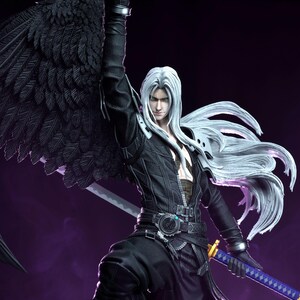May include: A detailed figurine of a character with long silver hair, green eyes, and a black outfit. The figure has a large black wing and is holding a sword with a blue and gold handle. The background is a gradient of purple and black.
