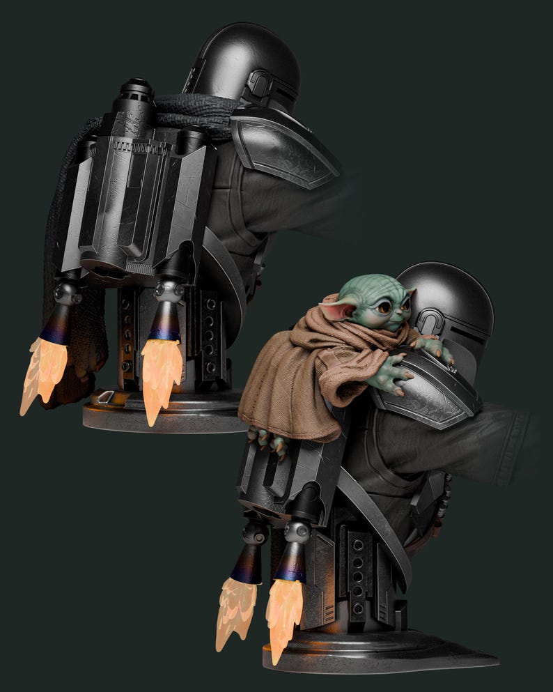 May include: A detailed statue of The Mandalorian with Grogu. The Mandalorian is in black armor with a jetpack, and Grogu is wrapped in a brown cloak. The jetpack has orange flame effects, and the statue is on a dark gray base.