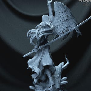 May include: A detailed figurine of a character with long hair, a flowing robe, and a large wing. The figure is holding a sword and is posed on a rocky base. The text "PRE-SUPPORTED 1:6 SCALE" is visible.