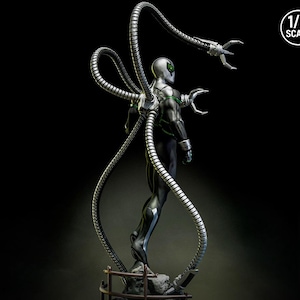 May include: A 1/6 scale statue of a character in a black and silver suit with four metallic tentacles extending from the back. The figure has a silver helmet and green accents. The statue is posed on a small, detailed base.