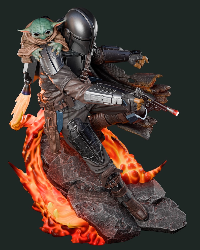 May include: A detailed statue of The Mandalorian, clad in dark armor, holding a blaster, with Grogu perched on his shoulder. The figure is set against a backdrop of fiery orange and red flames and rocky terrain, creating a dynamic action pose.