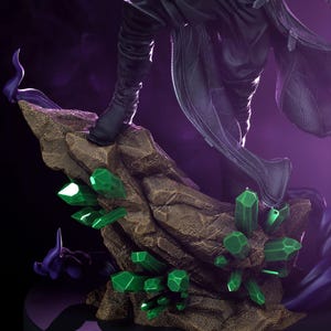 May include: A detailed figurine featuring a figure in black attire, standing on a rocky base adorned with vibrant green crystal formations. The base is a textured brown, set against a dark purple backdrop.