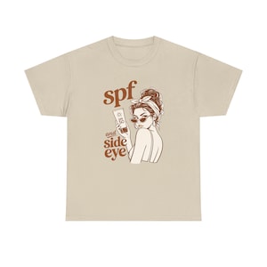Ilustración de camiseta con SPF y ojo de reojo / Protector solar, gráfico de mujer atrevida