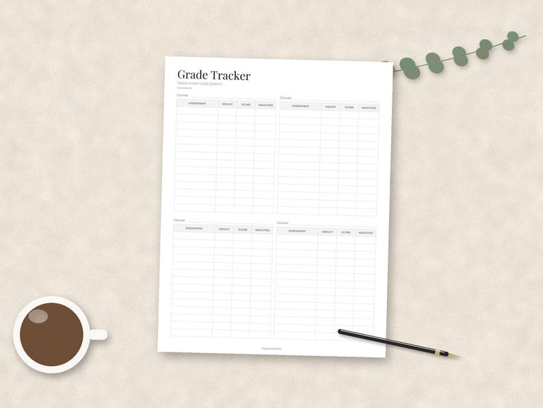 May include: A white paper sheet titled Grade Tracker with four distinct sections for recording course assessments, weights, scores, and weighted totals. The document features a clean grid layout with black text and lines, accompanied by a black pen.