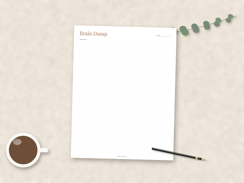 May include: A white paper sheet with a grid pattern and the text Brain Dump printed in brown at the top left corner. The sheet includes a date line in the top right corner. A black pen and a cup of coffee are positioned near the paper.