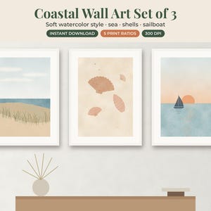 May include: A set of three framed wall art prints featuring watercolor illustrations. The first shows a beach with dunes, the second displays various seashells on a beige background, and the third depicts a sailboat on water at sunset.
