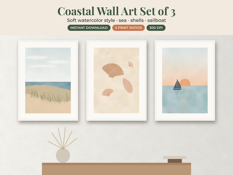 May include: A set of three framed wall art prints featuring watercolor illustrations. The first shows a beach with dunes, the second displays various seashells on a beige background, and the third depicts a sailboat on water at sunset.