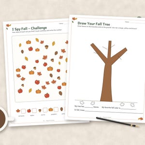 May include: Two white activity sheets featuring fall themes. The left sheet is titled I Spy Fall - Challenge with illustrations of pumpkins, apples, acorns, and leaves. The right sheet is titled Draw Your Fall Tree with a brown tree outline.