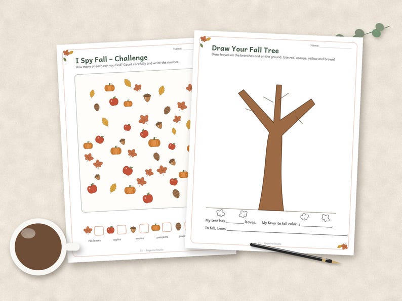 May include: Two white activity sheets featuring fall themes. The left sheet is titled I Spy Fall - Challenge with illustrations of pumpkins, apples, acorns, and leaves. The right sheet is titled Draw Your Fall Tree with a brown tree outline.