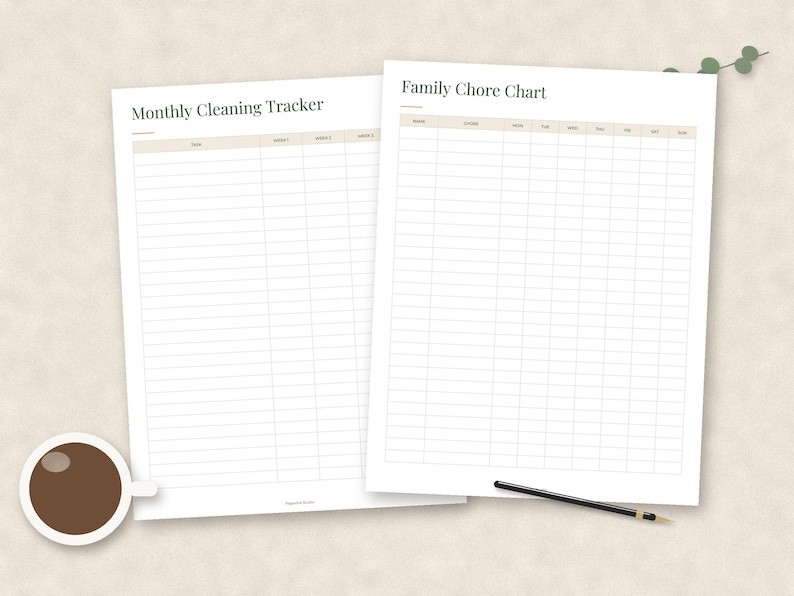 May include: Two white paper sheets featuring printed grids. The left sheet is titled Monthly Cleaning Tracker with columns for task and weeks. The right sheet is titled Family Chore Chart with columns for name, chore, and days of the week.