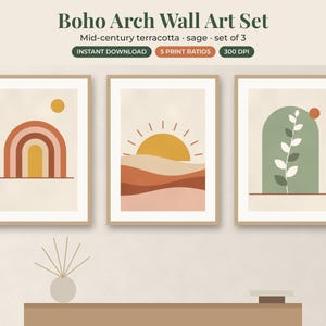 May include: A set of three wall art prints featuring abstract designs in terracotta, sage, and yellow. The first print shows a rainbow and sun, the second a sun over hills, and the third a plant inside an arch. Text reads Boho Arch Wall Art Set.