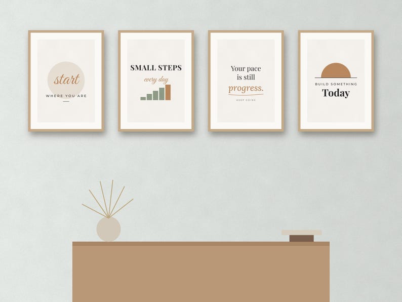 May include: Four framed wall art prints with light beige backgrounds and motivational text. The first reads start WHERE YOU ARE, the second SMALL STEPS every day with a bar graph, the third Your pace is still progress, and the fourth BUILD SOMETHING Today.