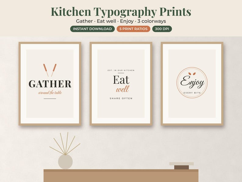 May include: Three framed wall art prints featuring kitchen typography. The first reads GATHER around the table, the second Eat well SHARE OFTEN, and the third Enjoy EVERY BITE. The designs use black and terracotta text on a light beige background.