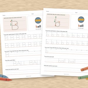 May include: Two educational worksheets for practicing the letter B and b, featuring tracing lines, directional arrows, and a ball illustration. The pages include prompts to trace capital B, lowercase b, and the word ball, accompanied by four colored crayons.