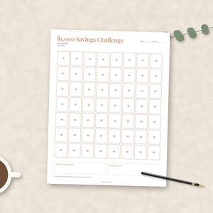 May include: A white paper savings tracker sheet titled $1,000 Savings Challenge with a grid of boxes containing various dollar amounts. The document includes fields for start and finish dates, a goal of $1,000, and sections for savings notes.