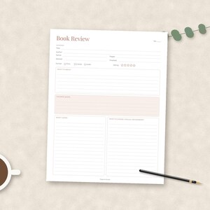 May include: A white paper book review template featuring the title Book Review, fields for author, genre, pages, started, finished, format, and rating. It includes sections for thoughts, favorite quotes, and what to remember, with a black pen nearby.