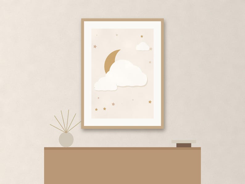 May include: A framed wall art print featuring a gold crescent moon, white clouds, and small gold stars against a light beige background. The artwork is enclosed in a simple light wood frame, displaying a celestial theme with soft colors.