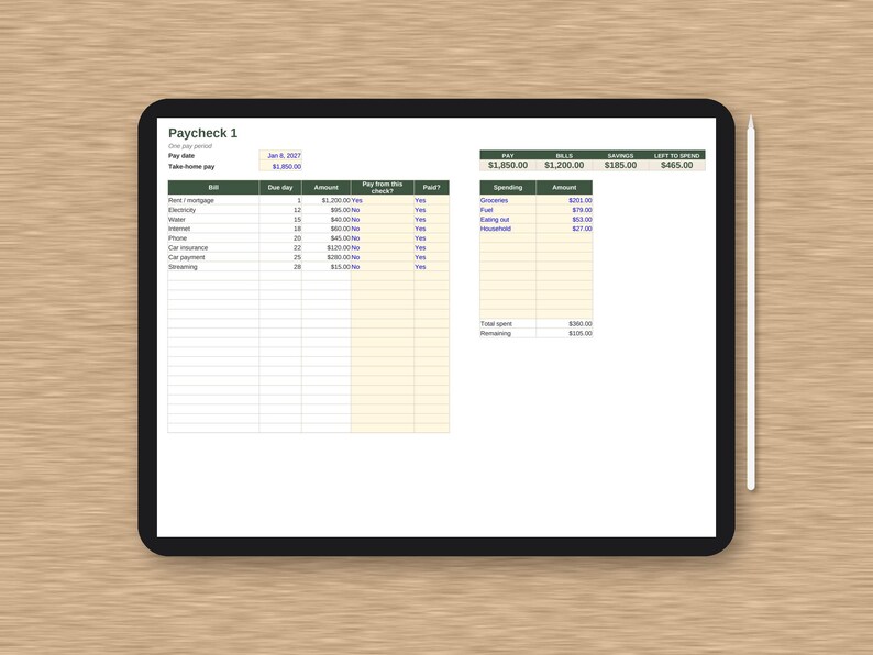 May include: A digital tablet displaying a Paycheck 1 budget tracker spreadsheet with columns for bills, due dates, and amounts, alongside a spending summary table. A white stylus is positioned vertically to the right of the black-framed tablet.