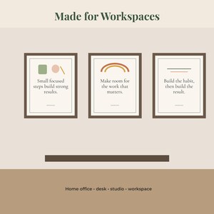 May include: Three framed wall art prints with dark brown frames. The first print features a green square, a pink circle, and a line with the text: Small focused steps build strong results. The second shows a rainbow with the text: Make room for the work that matters. The third shows two lines with the text: Build the habit, then build the result. The top text reads: Made for Workspaces.