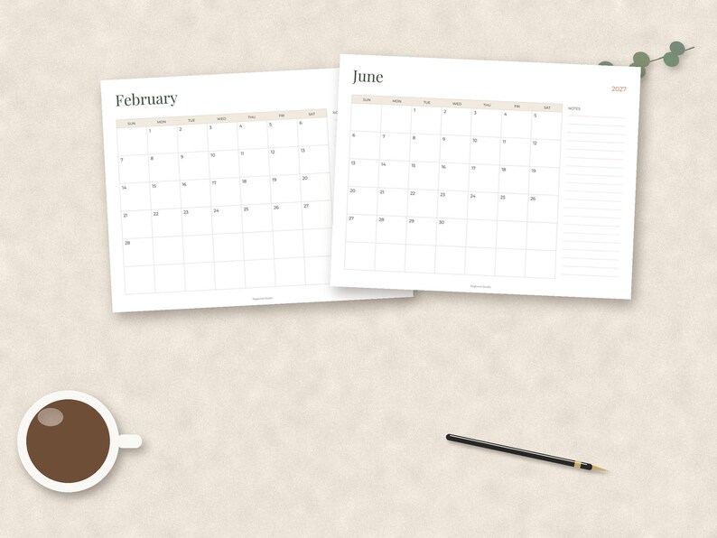 May include: Two white paper calendar sheets for February and June 2024 with a grid layout, a cup of dark coffee, and a thin black pen. The calendar pages feature black text, light gray grid lines, and a dedicated notes section on the right side.