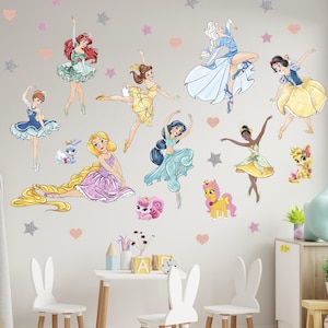 May include: Wall decals featuring illustrations of various princesses in ballet poses, surrounded by star and heart-shaped accents. The princesses are depicted in colorful dresses, with details like long hair and crowns. The decals are designed for children's rooms.