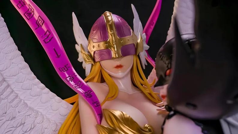 May include: A detailed figurine of a female character with long blonde hair, wearing a purple and gold helmet, and white wings. The figure has a revealing outfit with gold accents and is holding a pink object with Japanese text.