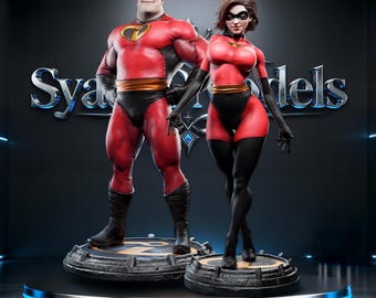 May include: Two superhero statues, a man and a woman, stand together. They wear red and black costumes with gold details. The man has a black mask, and the woman has a black mask and gloves. They are on circular bases.