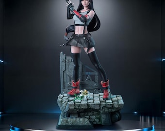 May include: A detailed figurine of a female character from Final Fantasy. She is posed on a stone base, wearing a black skirt, red boots, and fingerless gloves. The figure has long black hair and is set against a dark, futuristic background.