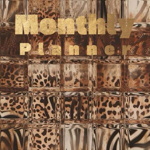 May include: A brown and gold monthly planner with a leopard print design. The words "Monthly Planner" are in gold lettering. The background has a textured, reflective appearance.