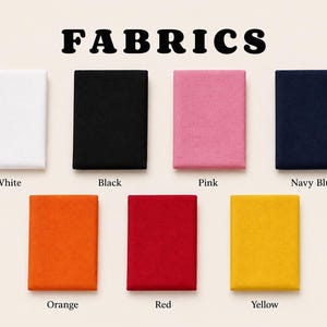 May include: Image showing fabric samples in white, black, pink, navy blue, orange, red, and yellow. The word "FABRICS" is displayed in bold, black letters at the top of the image.