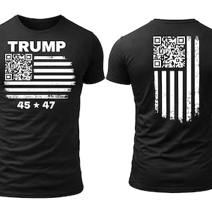 May include: Black t-shirt featuring a distressed American flag design with a QR code and the word "TRUMP" in white. The front of the shirt also displays "45 * 47". The back of the shirt has a similar flag design.