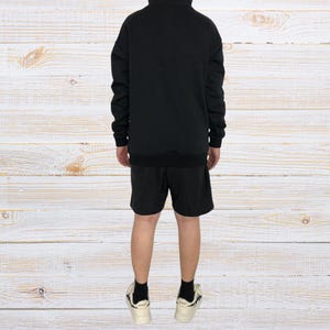 Unisex oversized AMIRI graphic hoodie in black and white streetwear style