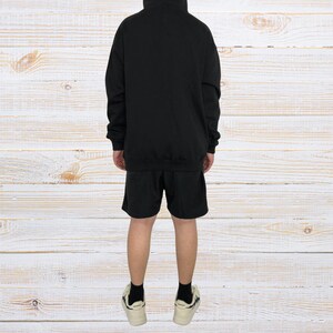 Unisex AMIRI-style hoodies in black and white with bold front graphic and stripe design, pullover streetwear sweatshirts with hood and kangaroo pocket.