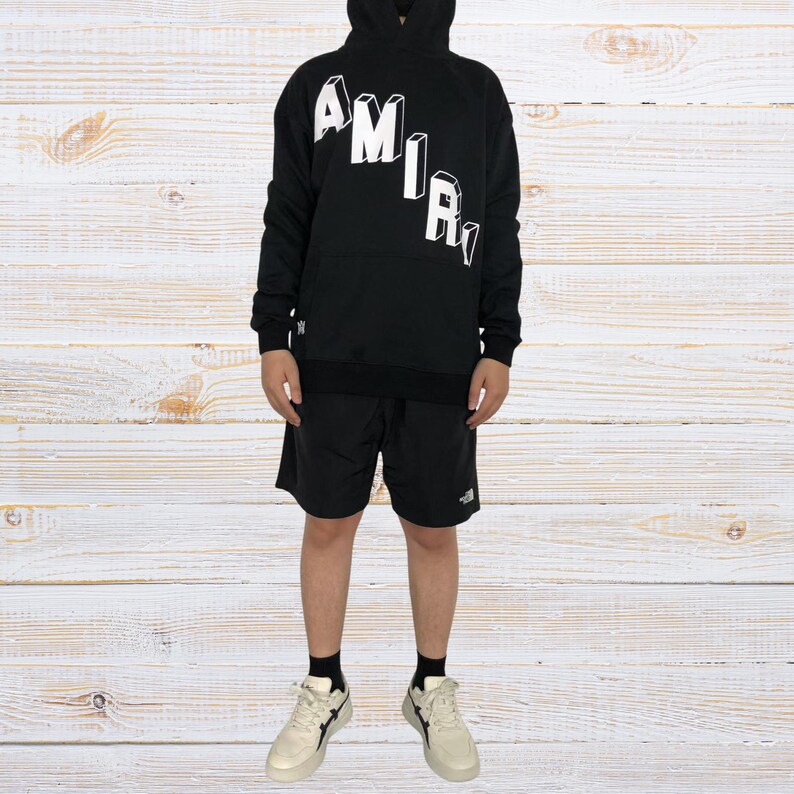 Unisex oversized AMIRI graphic hoodie in black and white streetwear style