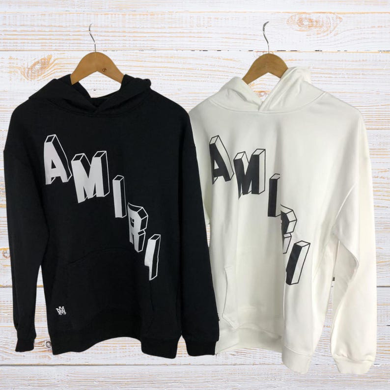 Unisex oversized AMIRI graphic hoodie in black and white streetwear style