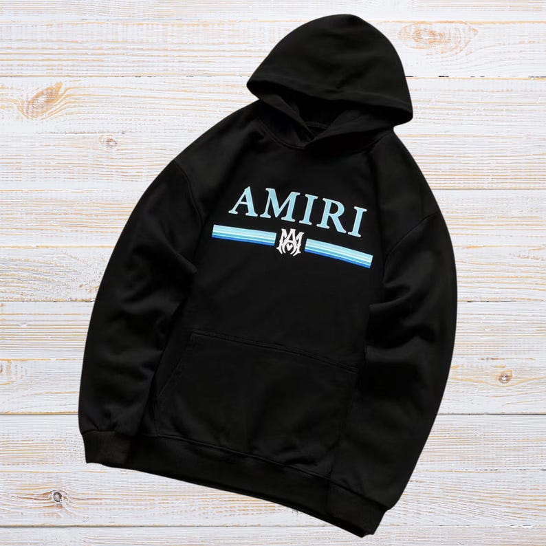 Unisex AMIRI-style hoodies in black and white with bold front graphic and stripe design, pullover streetwear sweatshirts with hood and kangaroo pocket.