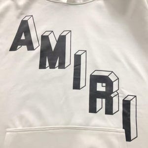 Unisex oversized AMIRI graphic hoodie in black and white streetwear style