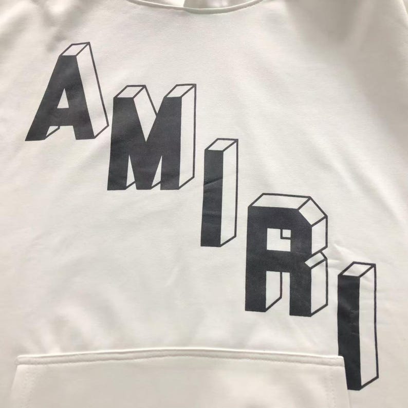 Unisex oversized AMIRI graphic hoodie in black and white streetwear style