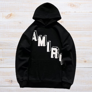Unisex oversized AMIRI graphic hoodie in black and white streetwear style