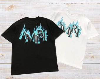Maglietta con grafica fiamma Y2K AMIRI